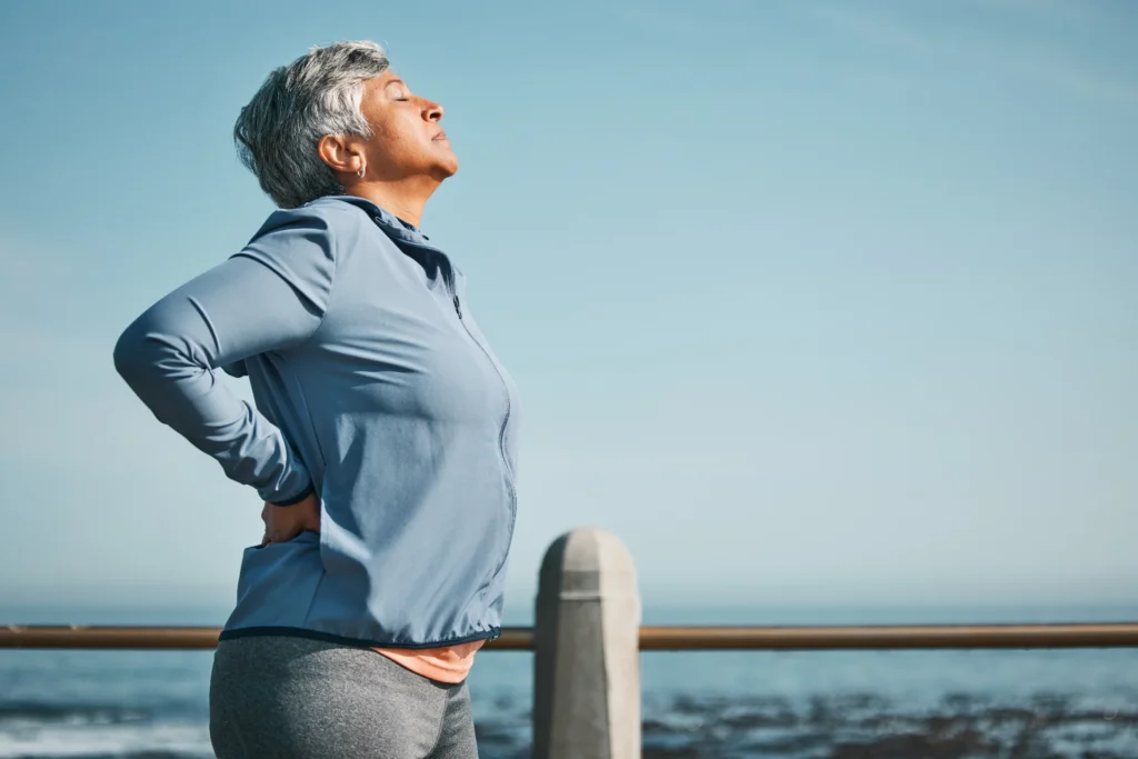 tired running and senior woman back pain by the o 2026 03 25 06 32 20 utc