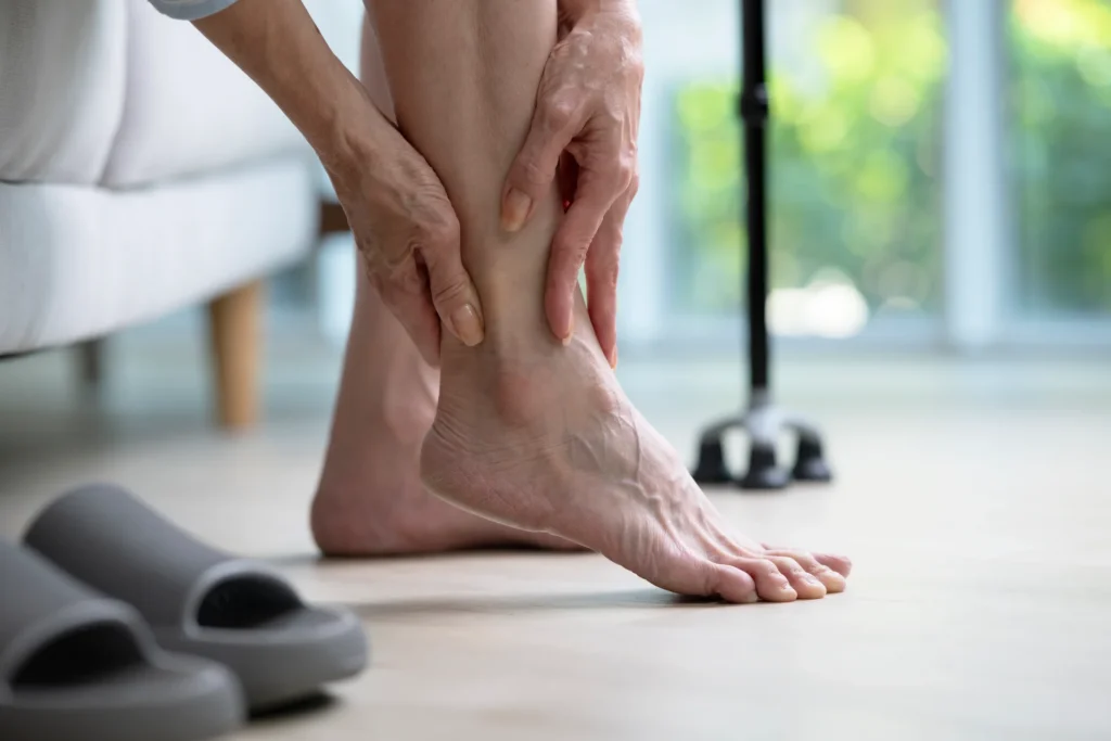 adult massaging aching foot inside 2026 03 25 04 22 26 utc